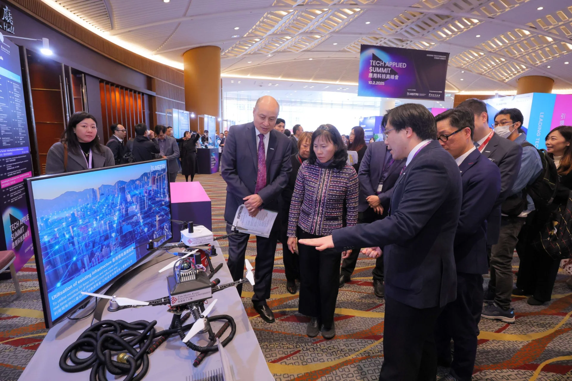 Picture shows Ms Mable Chan, Secretary for Transport and Logistics, HKSAR Government, accompanied by ASTRI senior management, touring at the Technovation Zone, which showcases the latest innovations from ASTRI and 20 local tech companies and institutions
