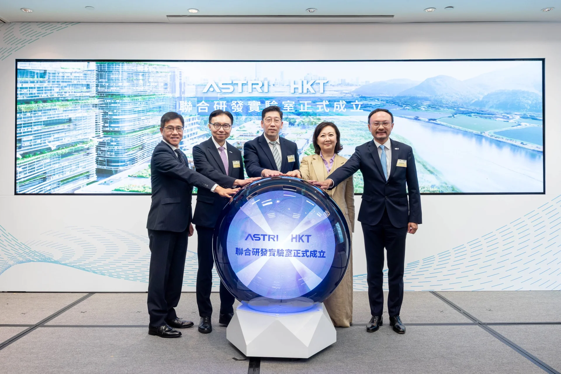 Joining the lighting ceremony are, (from left) Ir Dr Ted Suen, Chief Executive Officer of ASTRI; Ir Prof Sunny Lee, Board Chairman of ASTRI; Mr Daniel Cheung, the Acting Commissioner for Digital Policy of the HKSAR Government; Ms Susanna Hui, Group Managing Director of HKT, and Mr Steve Ng, Managing Director of Commercial Group, HKT.