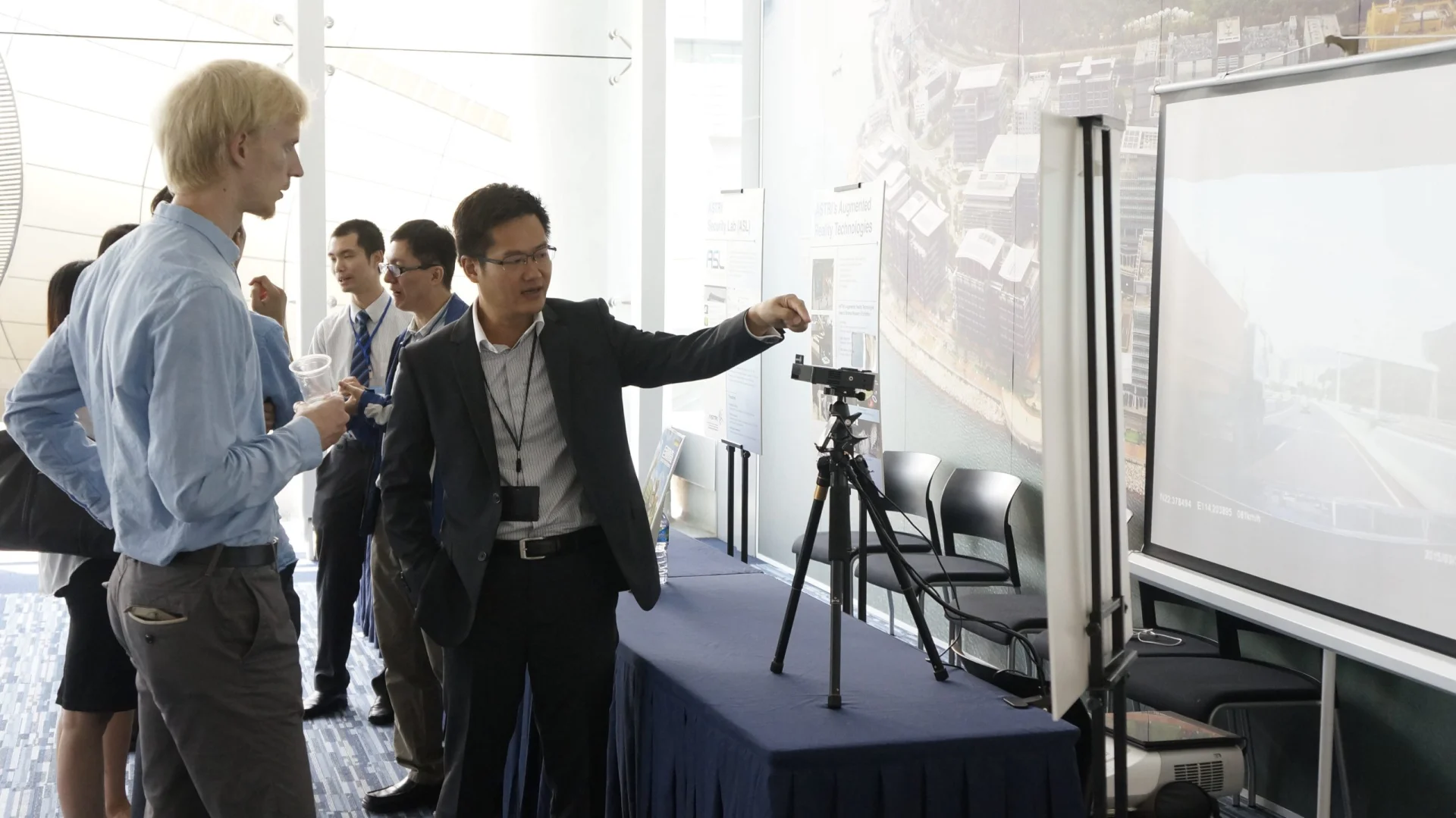 A demonstration of head up display (HUD) parts and technology developed by ASTRI and its industrial partner outside the venue.